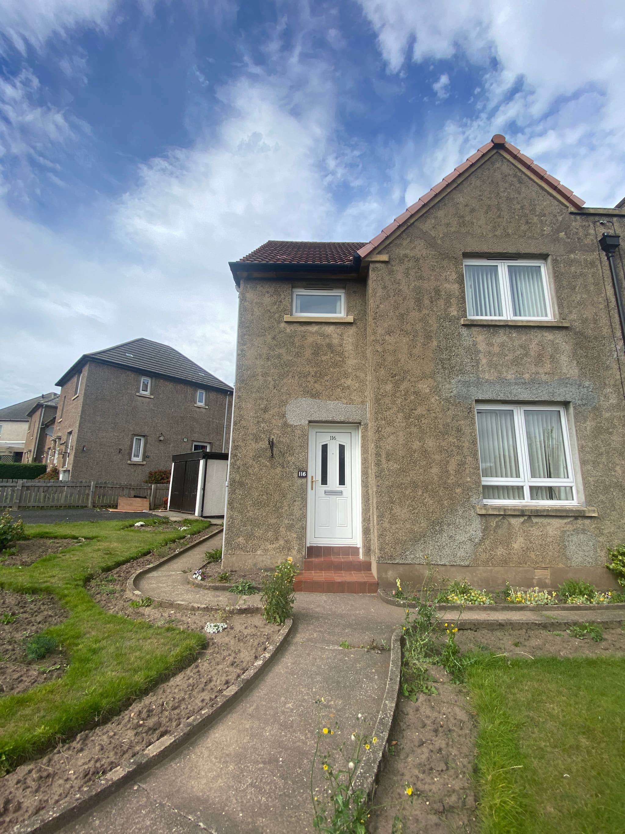 The front of Lisa's family home in St Andrews, with its garden and path